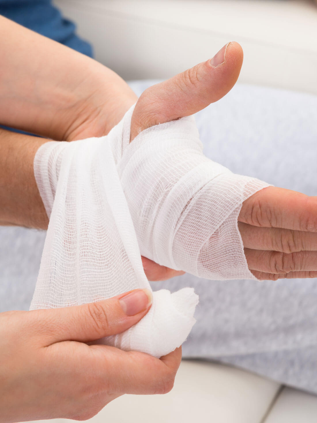 Nurse Bandaging Patient's Hand