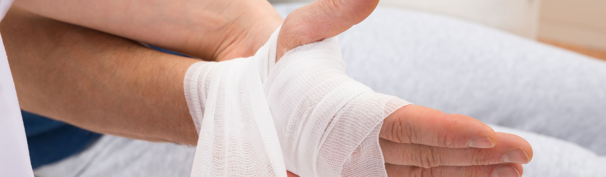 Nurse Bandaging Patient's Hand