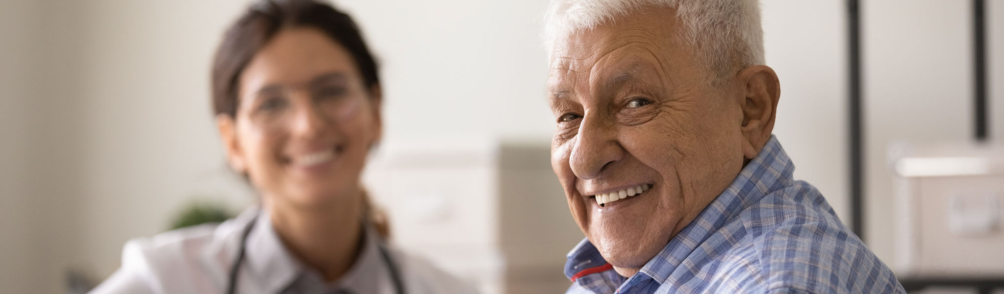 Happy Optimistic Senior Man Looking At Camera With Toothy Smile
