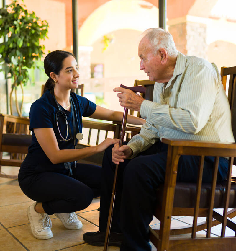 Nurse Helping Elderly Man
